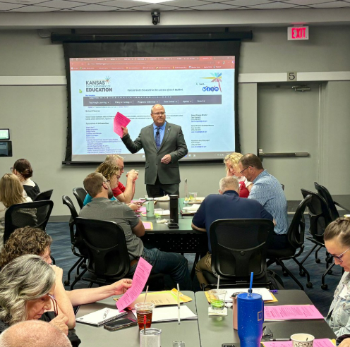 Dale Brungardt, (center) KSDE director of school finance, helped in hosting a budget workshop at Greenbush Education Service Center in June 2025, in Girard